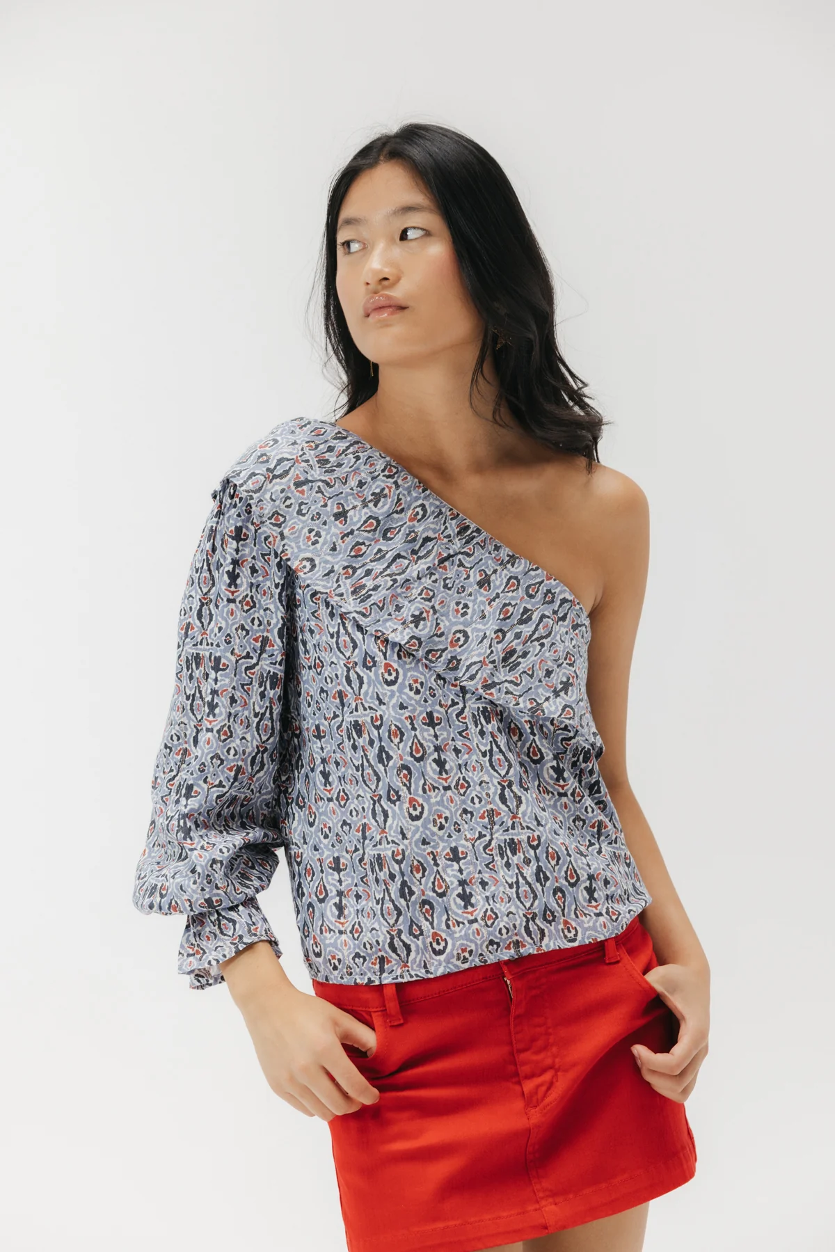 BLUSA TEEN ASIMÉTRICA ESTAMPADO GEOMÉTRICO MULTICOLOR